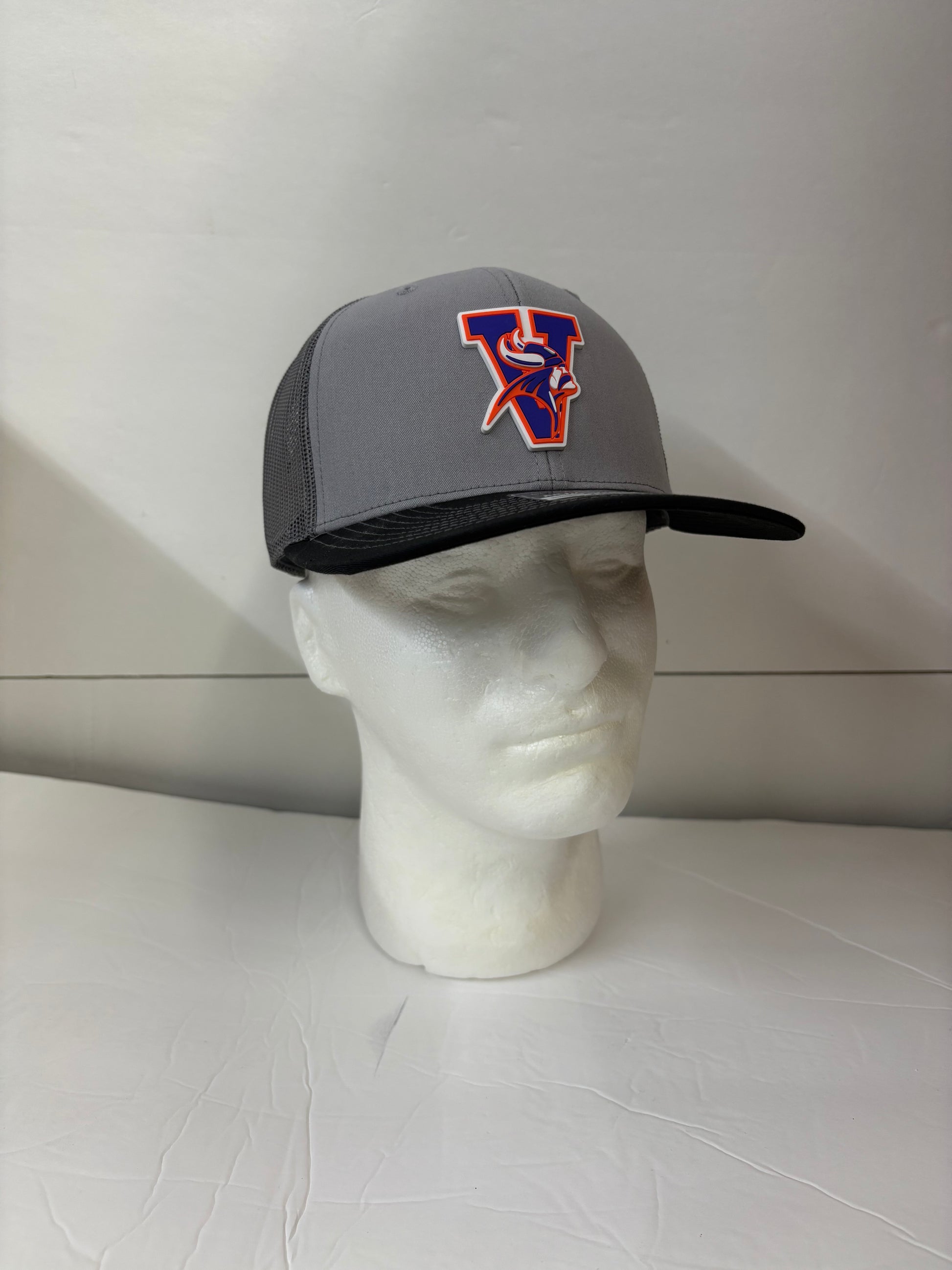 Gray Missouri valley college cap with a logo on a mannequin head against a white background